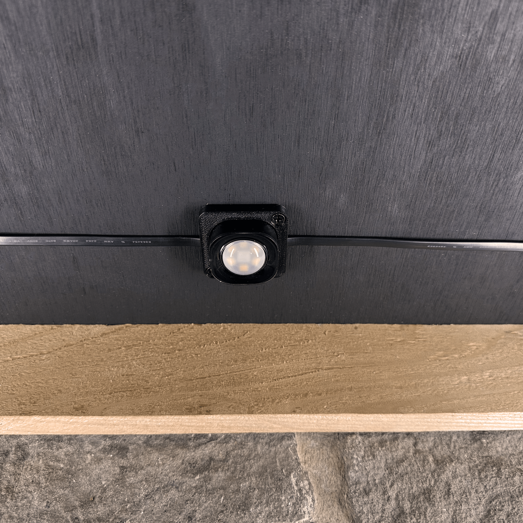 Slim Fit Pro - Secured LEDs - Black - 10 Brackets - 16.4 FT mounted showing one light up close-