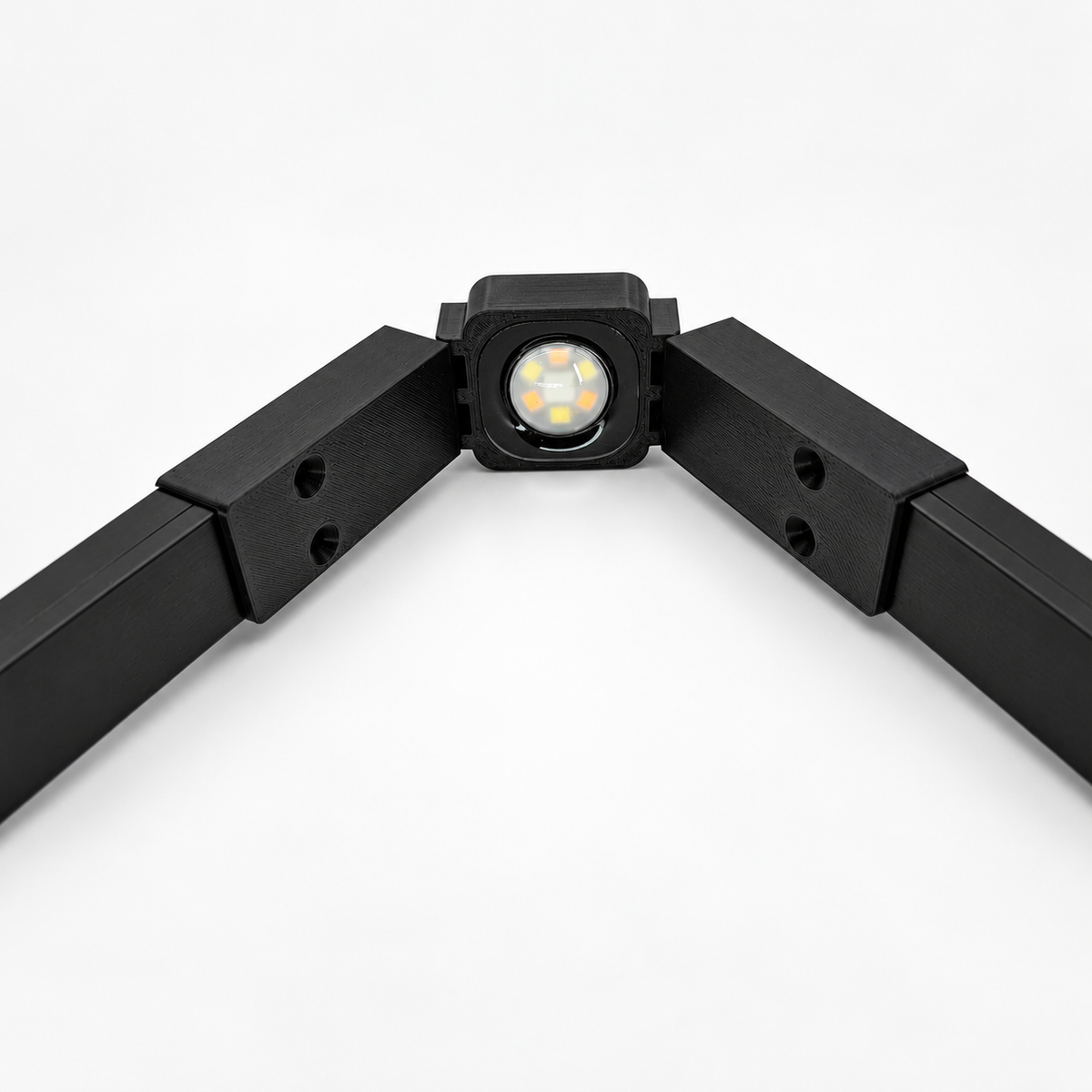 Black Govee Pro Channel Fit Peak Hinge holding a permanent outdoor LED light with black channels extending along both sides.